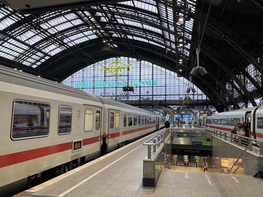 a train station with two trains parked next to each other