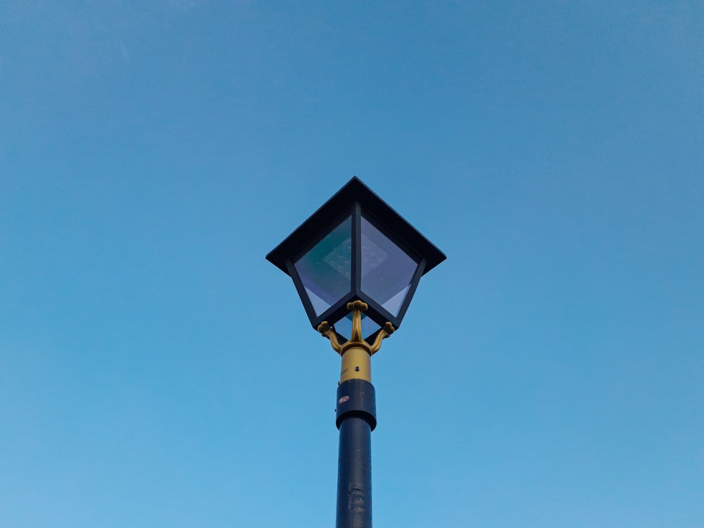 a street light with a blue sky in the background