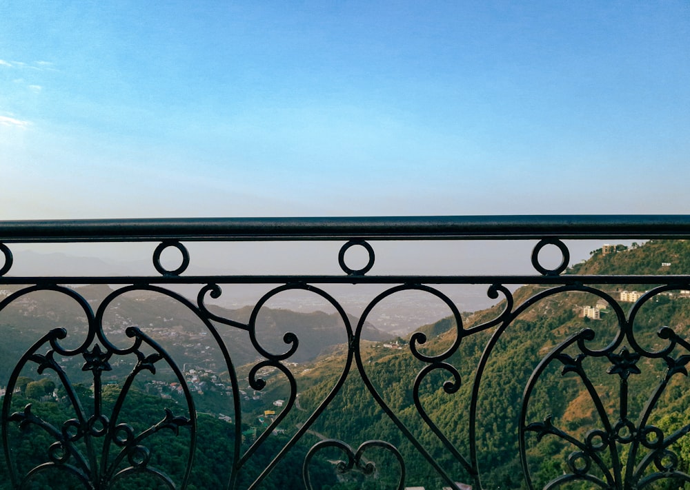 a balcony with a view of a valley and mountains