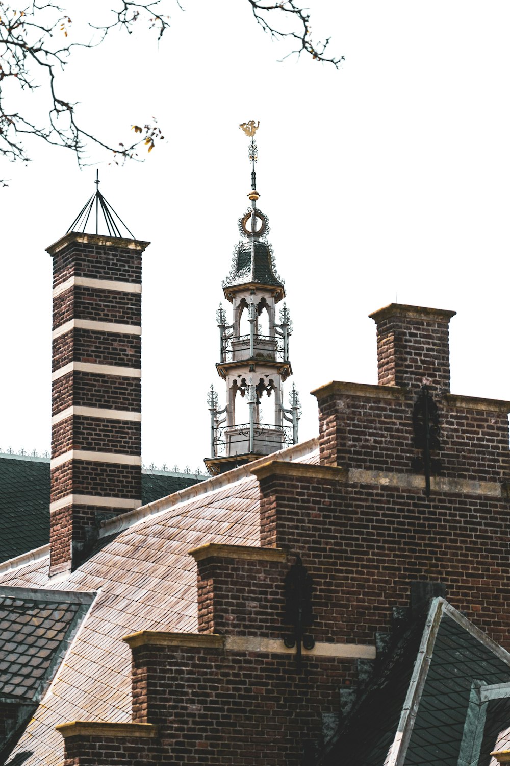 a brick building with a steeple and a clock tower