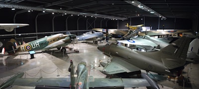 A modern hangar showcasing various aircraft.