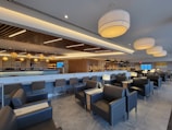 Modern lounge area at Hotel Lewestern featuring plush seating and ambient lighting.