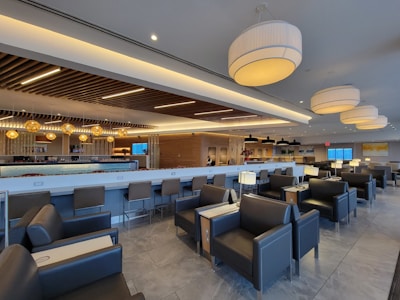 Spacious basement finished with modern lighting and comfortable seating.