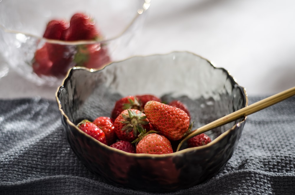 a bowl of strawberries on a table