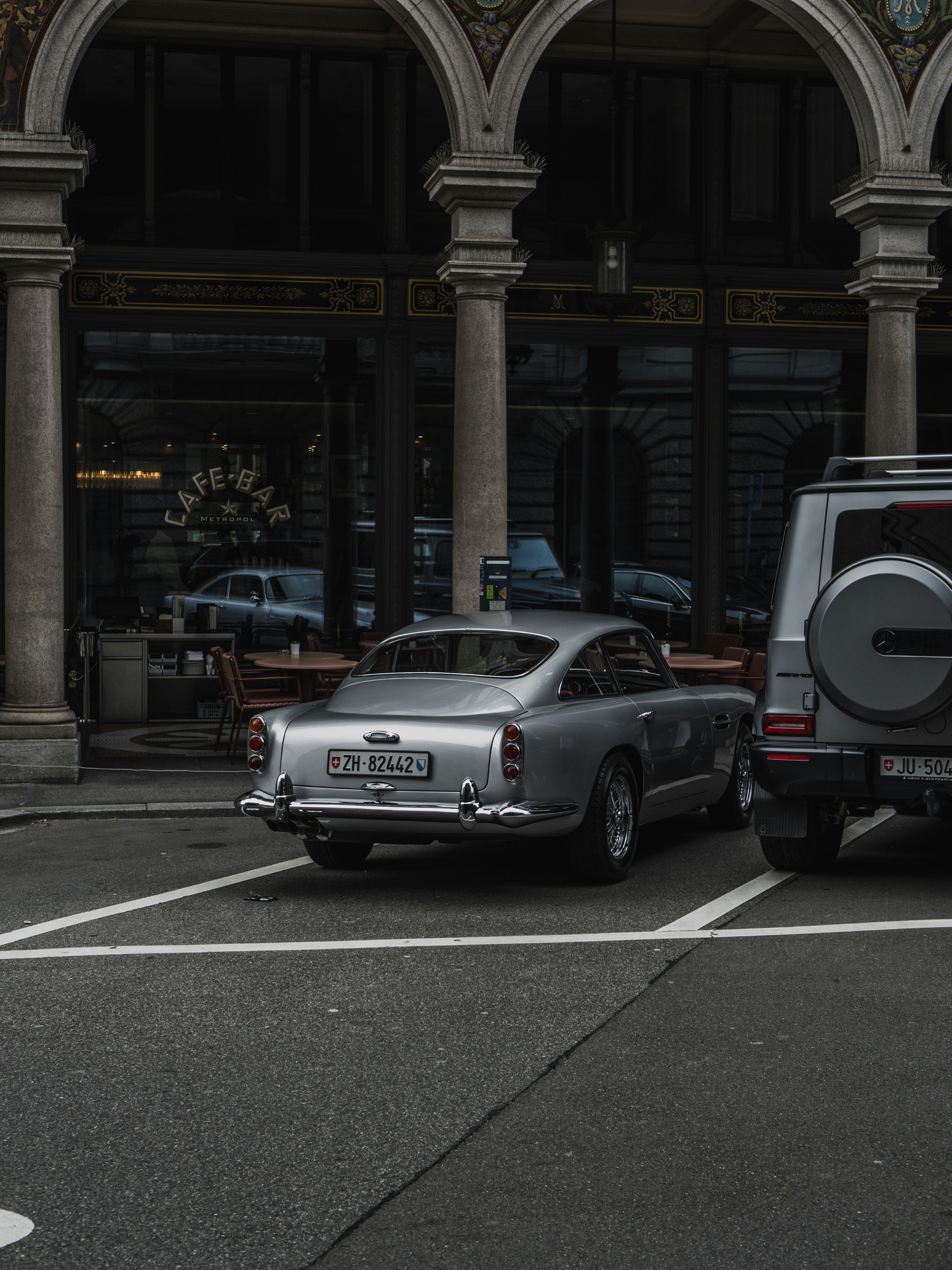a car parked in a parking lot next to a building