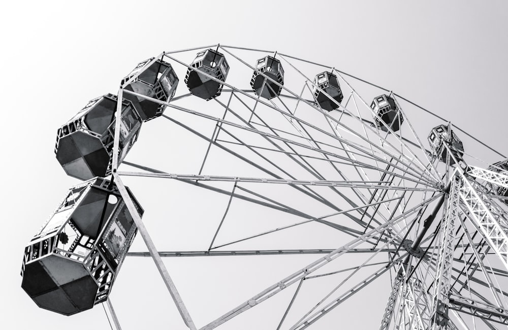 a black and white photo of a ferris wheel