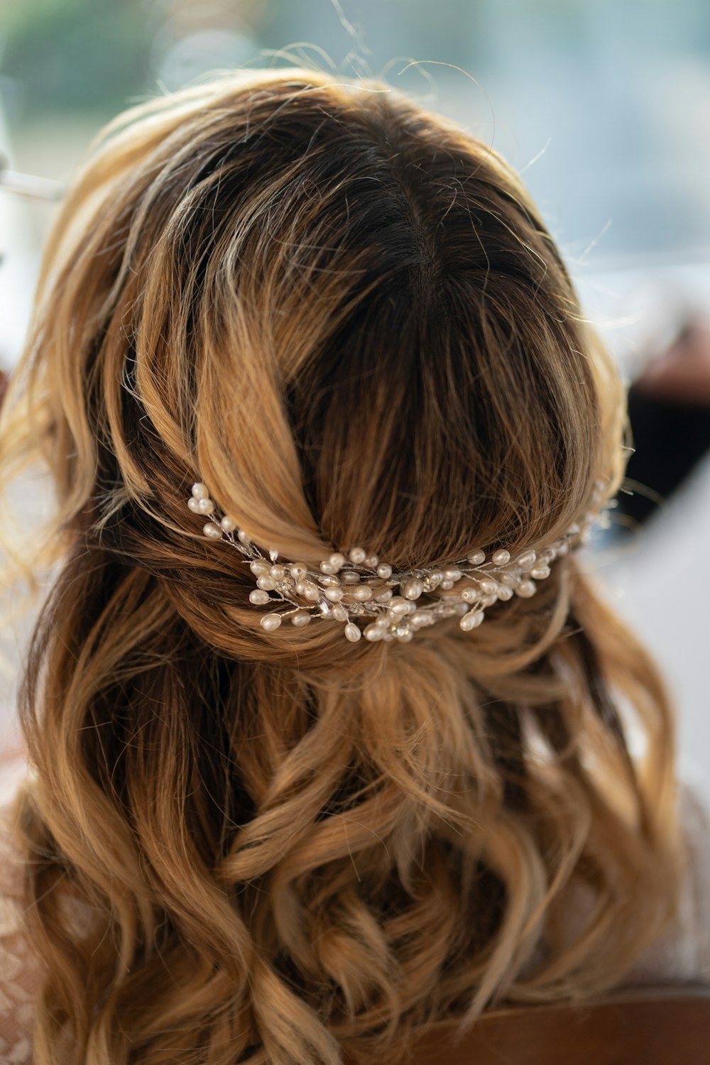 the back of a woman's head wearing a hair comb