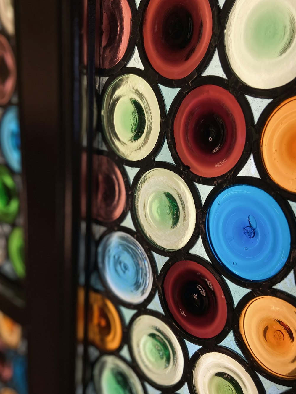a close up of a colorful glass window