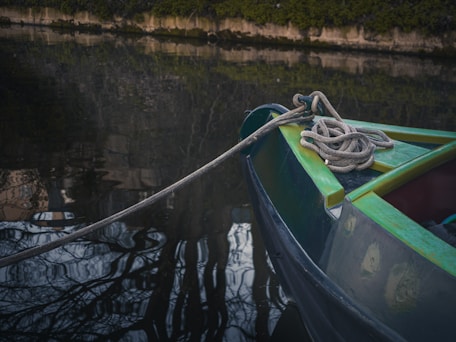 a boat with a rope tied to the front of it