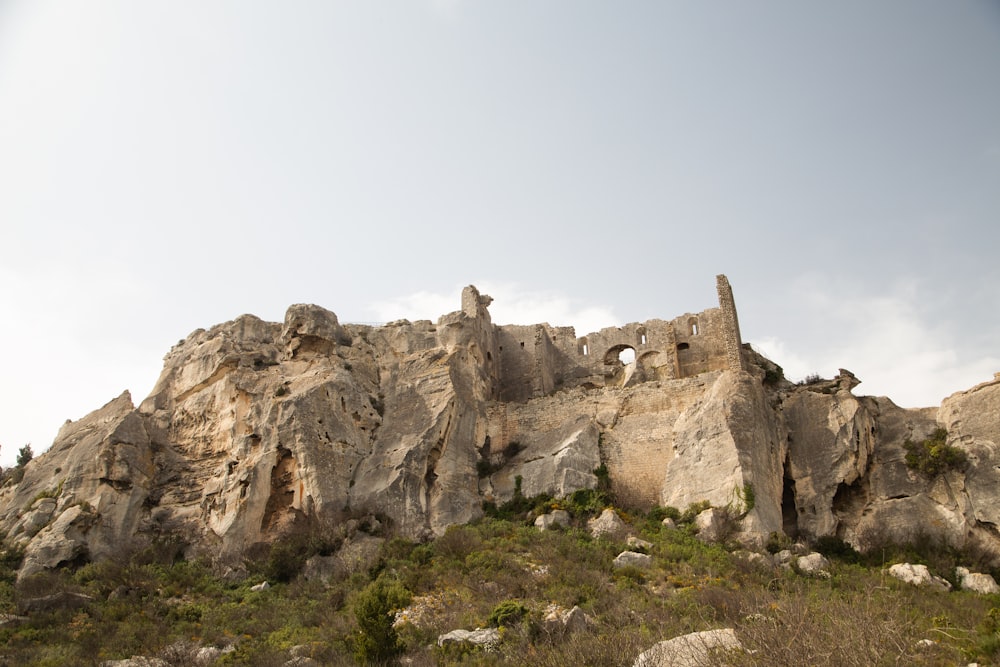 a large rock formation with a tower on top of it