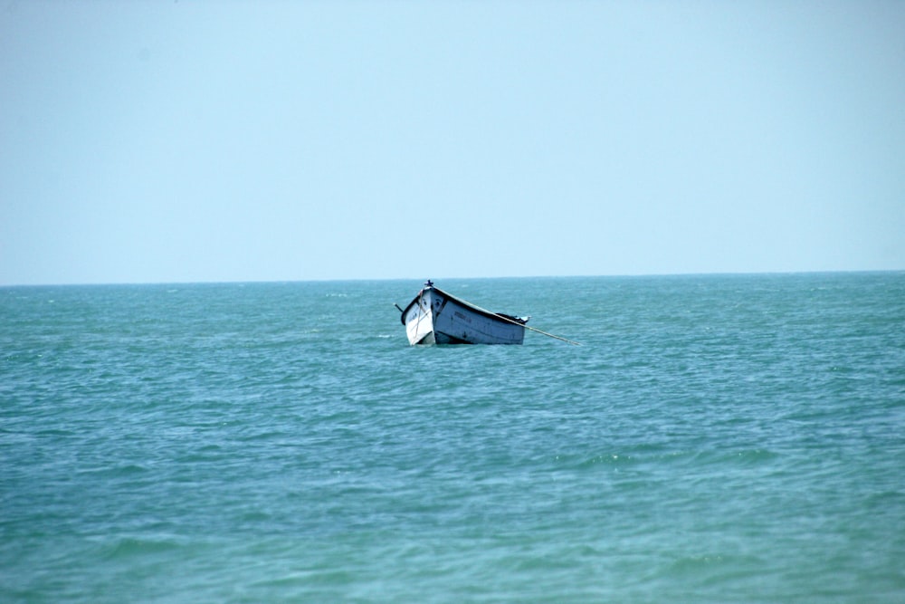 a boat in the middle of a body of water