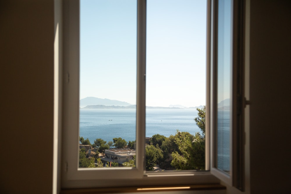 a window with a view of the ocean