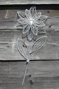 Decorative wooden and metal wall art inspired by natural forms.