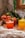 A vibrant assortment of colorful fruit juices in clear glasses.