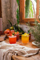A vibrant table set with guava jellies, infusions, and fresh guava slices ready to be enjoyed.