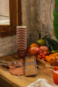 A cozy kitchen counter with fresh fruits, vegetables, and a handwritten recipe card.