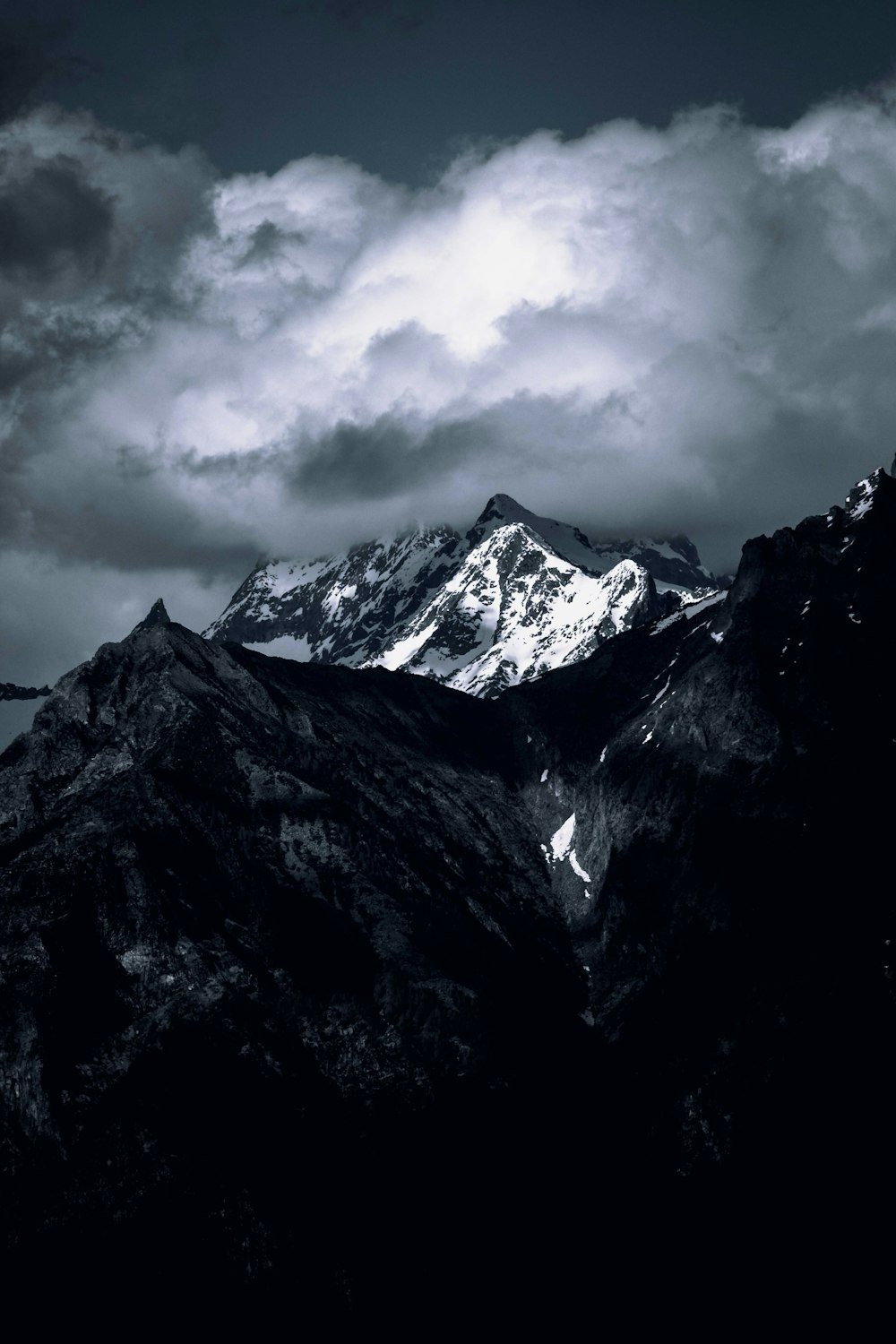 a black and white photo of a mountain range