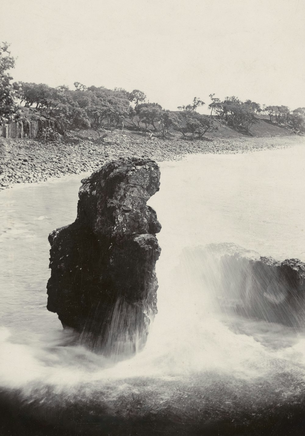 a black and white photo of a waterfall