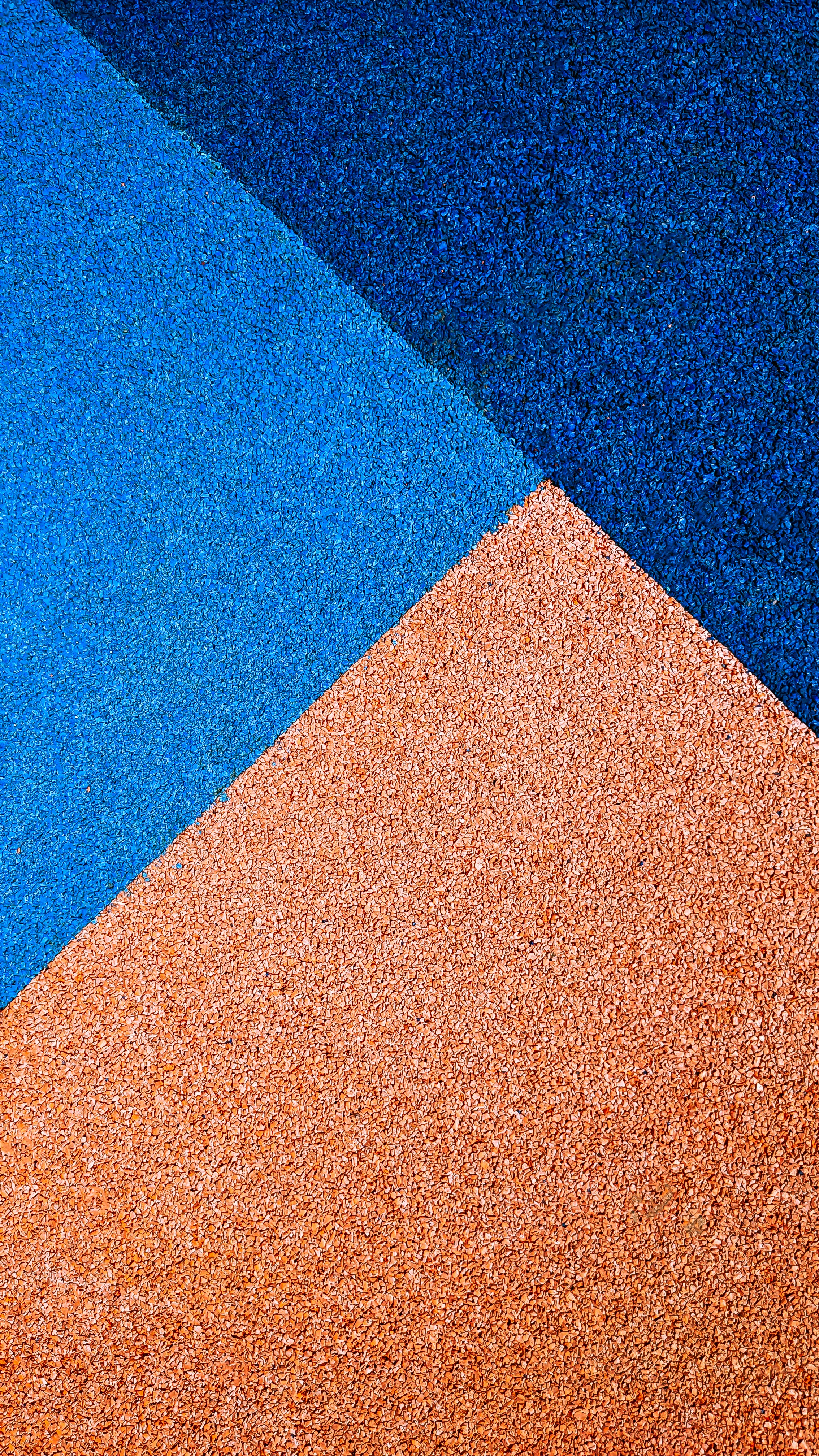 a close up of a blue and orange wall