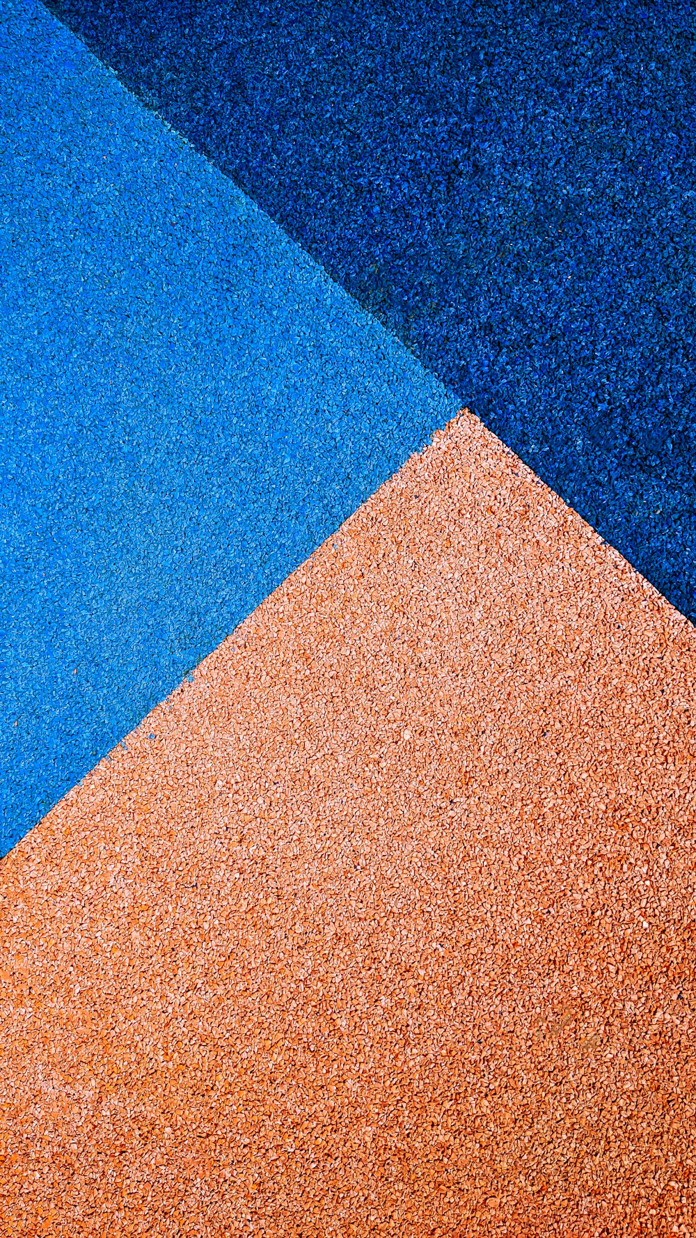 a close up of a blue and orange wall