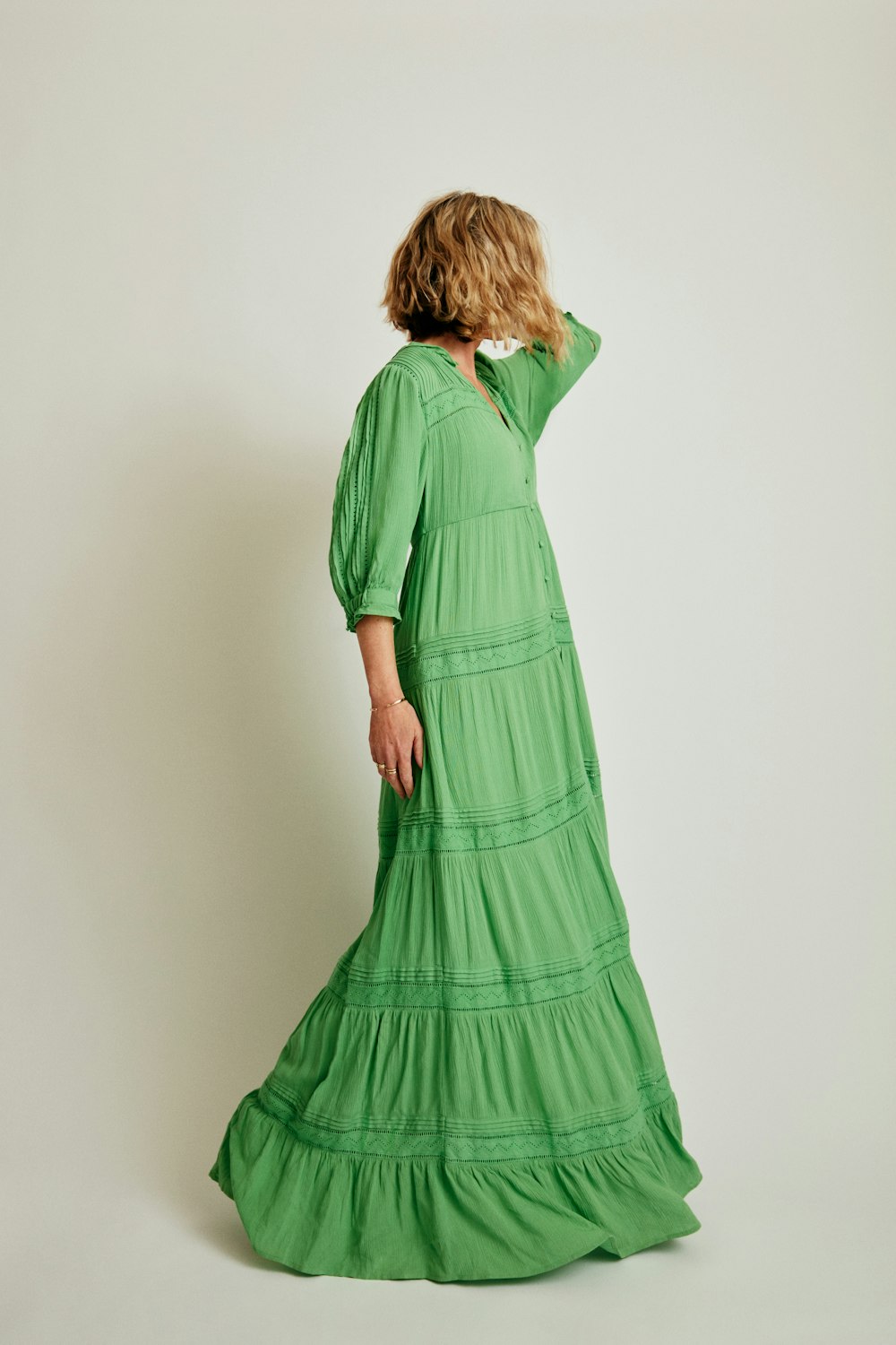 a woman in a long green dress