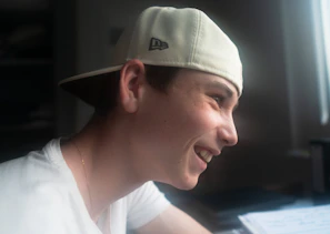 A casual photo of the blog author smiling while reading AI research papers.