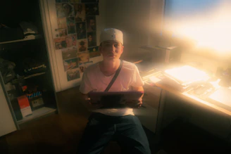 Portrait of the company founder in a cozy workspace filled with personal memorabilia.