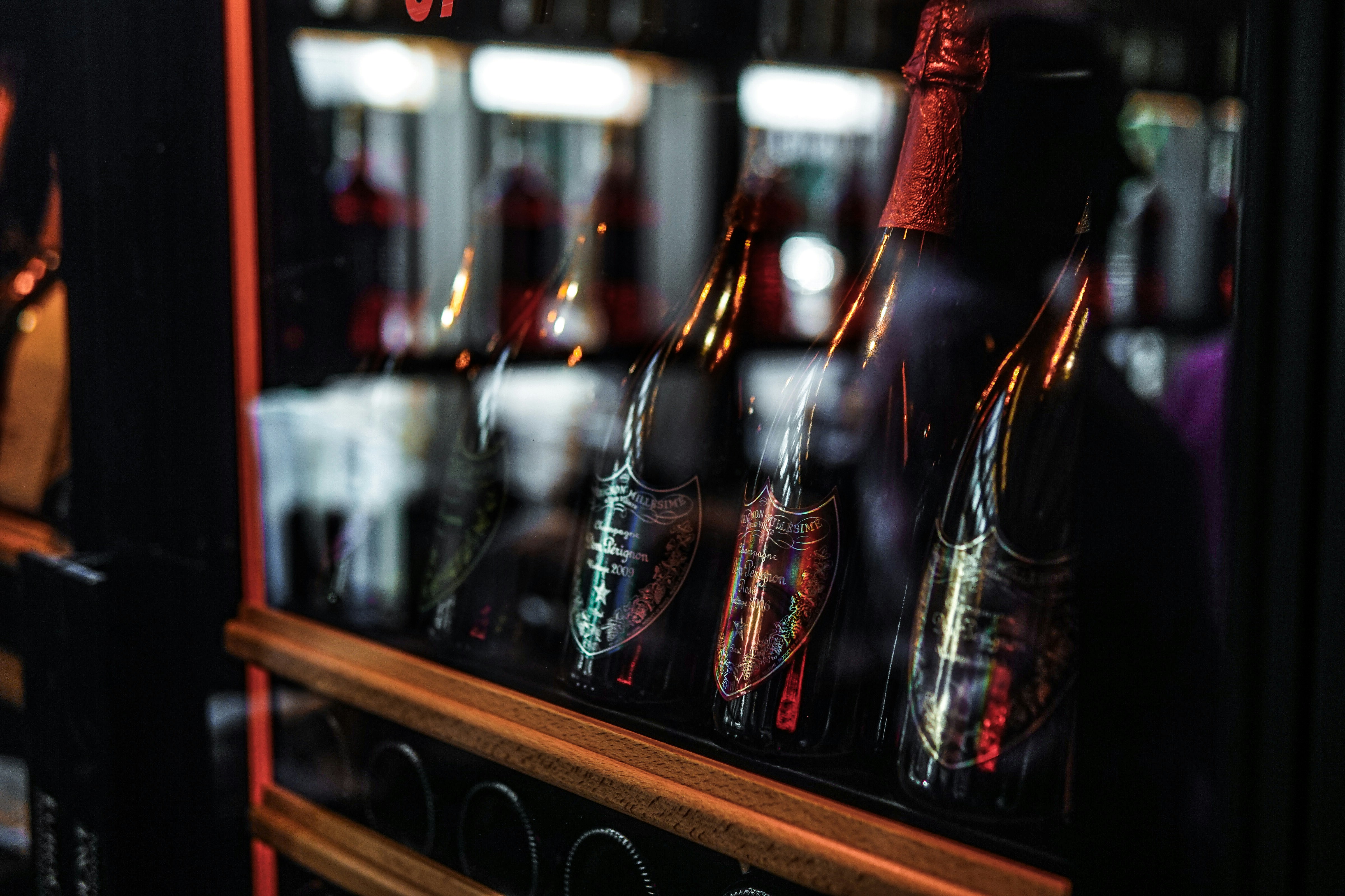 a close up of bottles of alcohol on a shelf