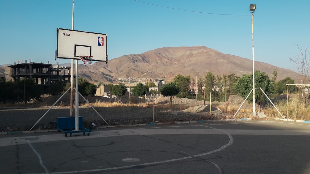 a basketball court with a basketball hoop in the middle of it