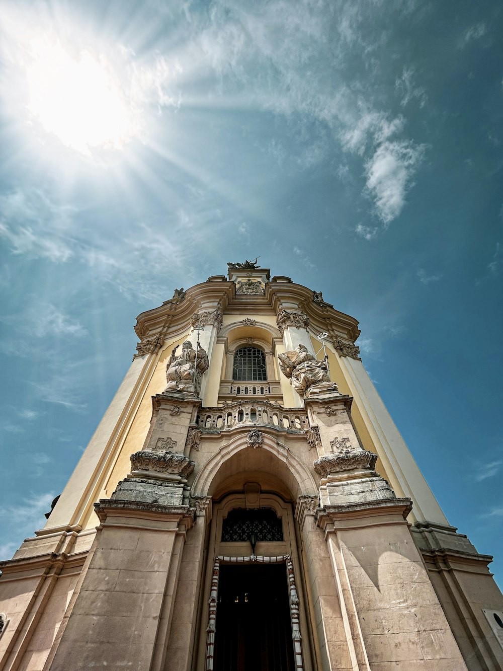 a tall tower with a clock on the top of it