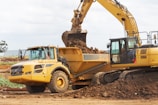 a bulldozer digging dirt on a construction site