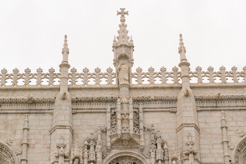 a large stone building with a clock on it's side