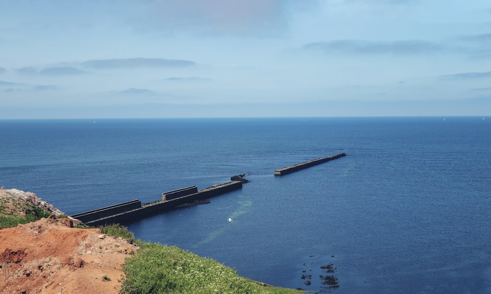 a large body of water sitting on top of a cliff