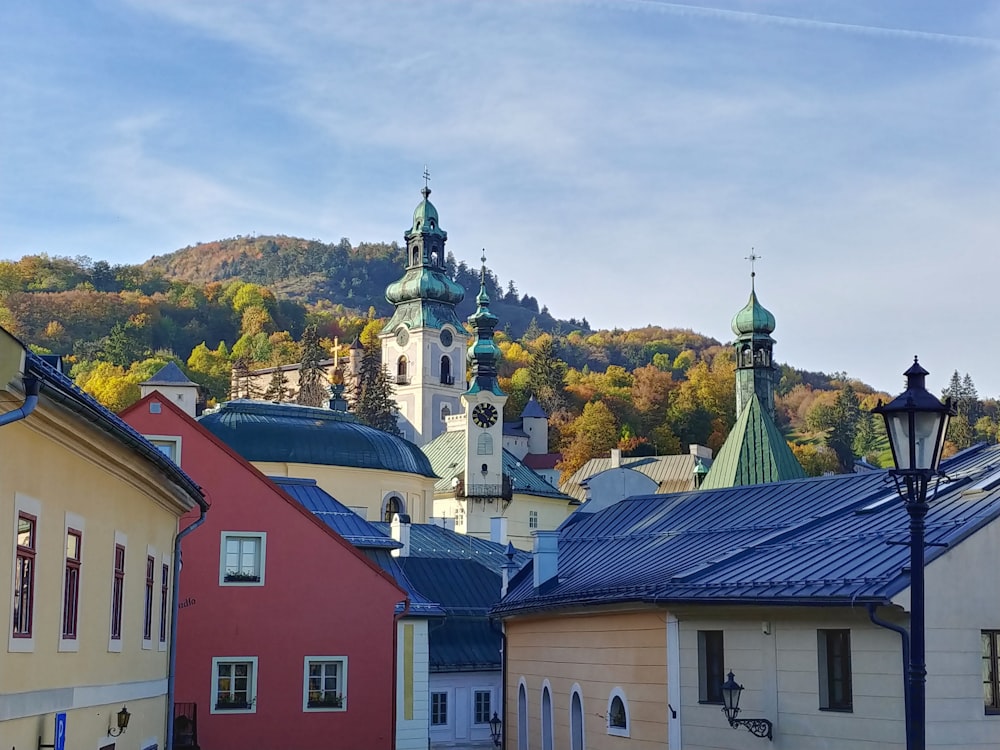 a view of a town with a church on a hill in the background