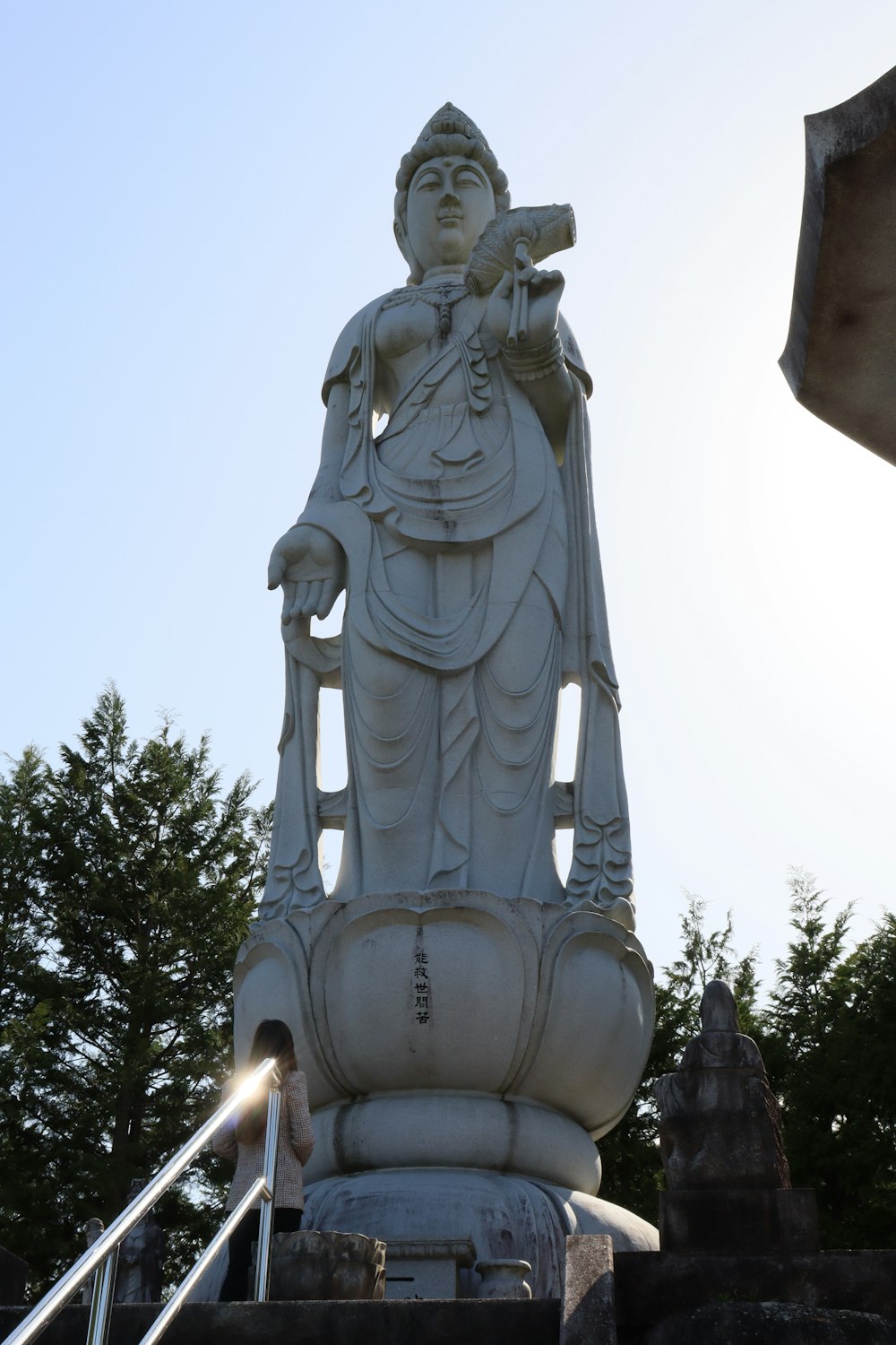 a statue of a person holding a sword