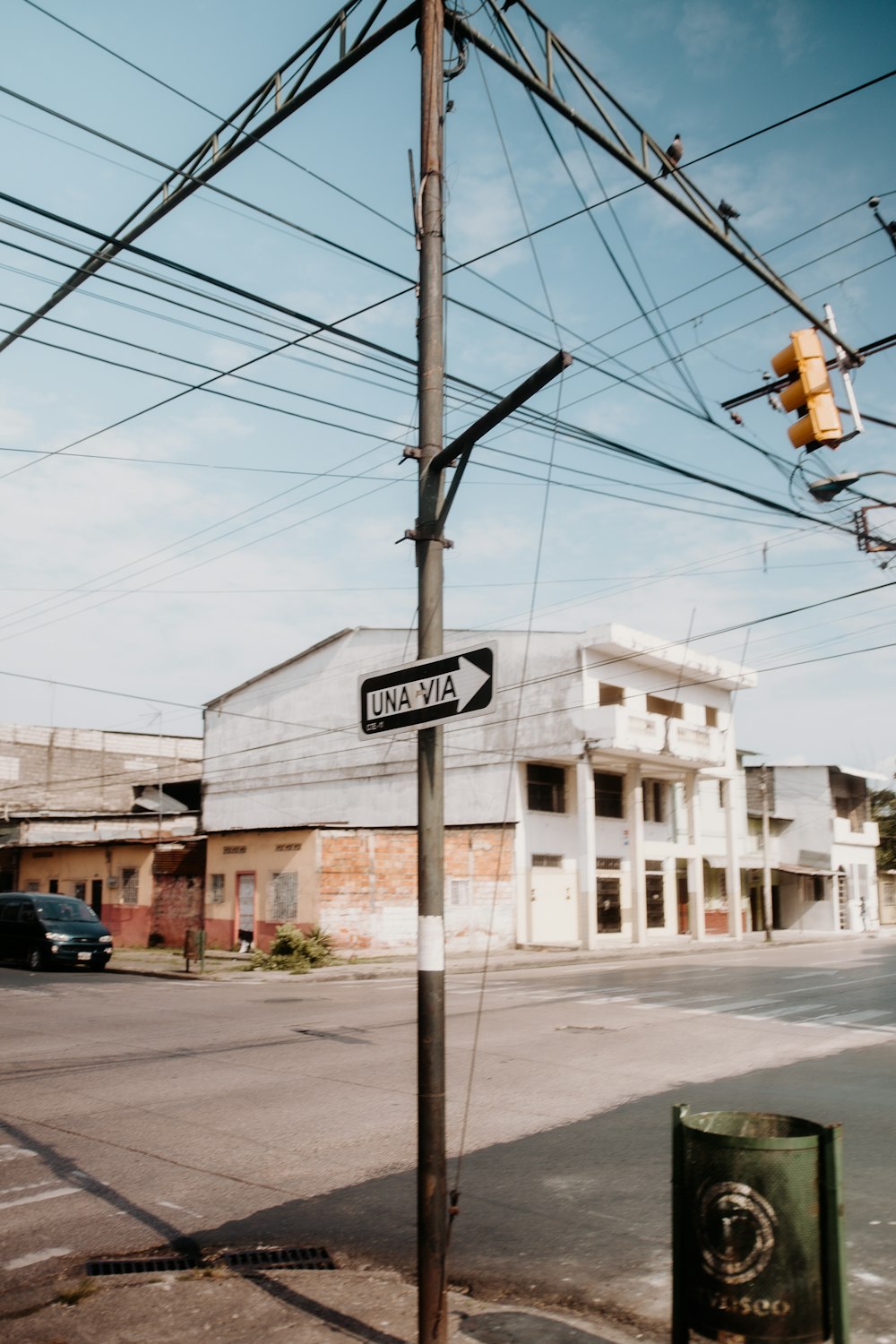 a street sign on a pole in front of a building