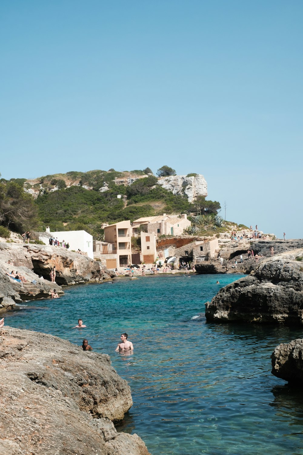 a body of water with people swimming in it