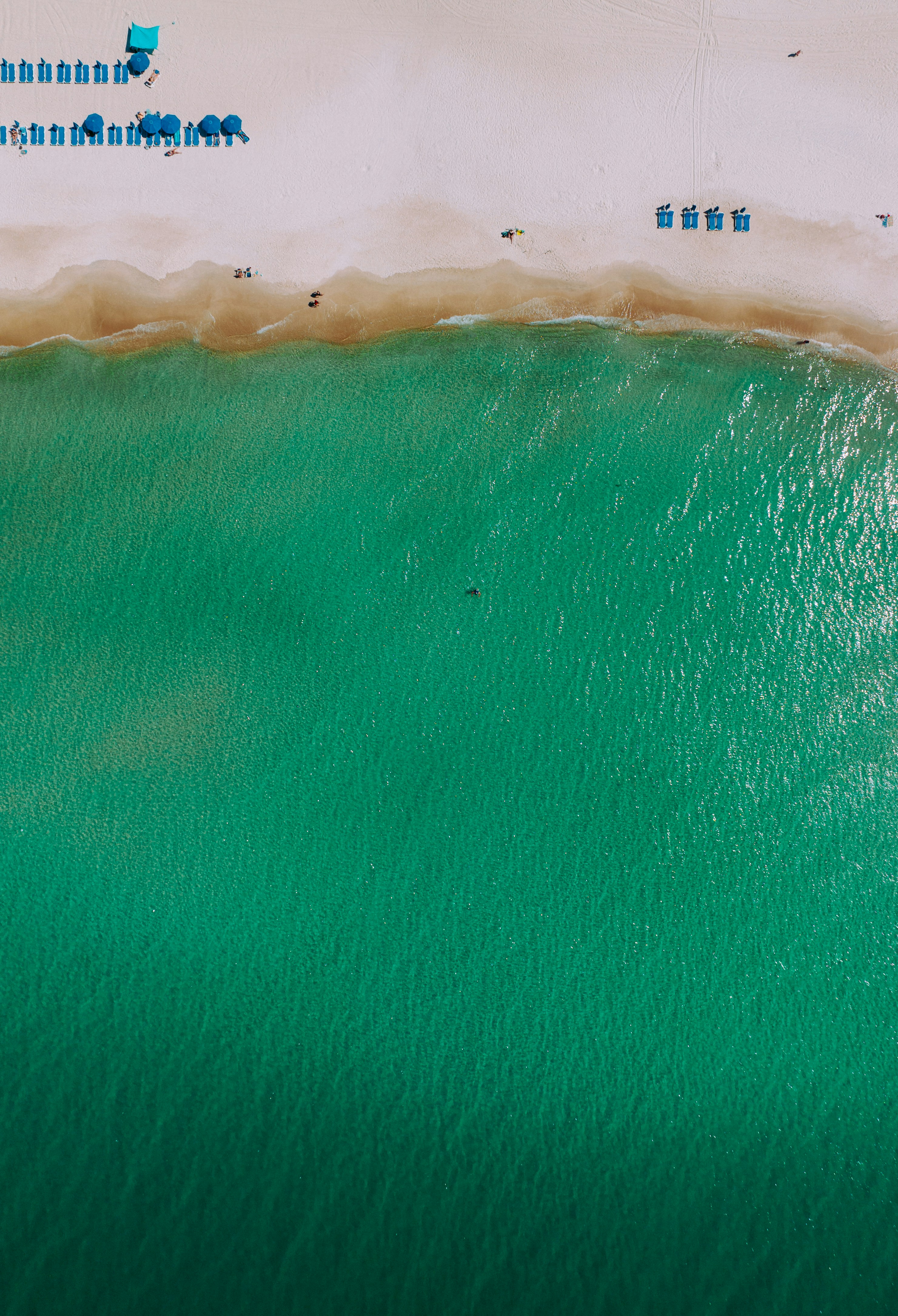 an aerial view of a beach with people on it