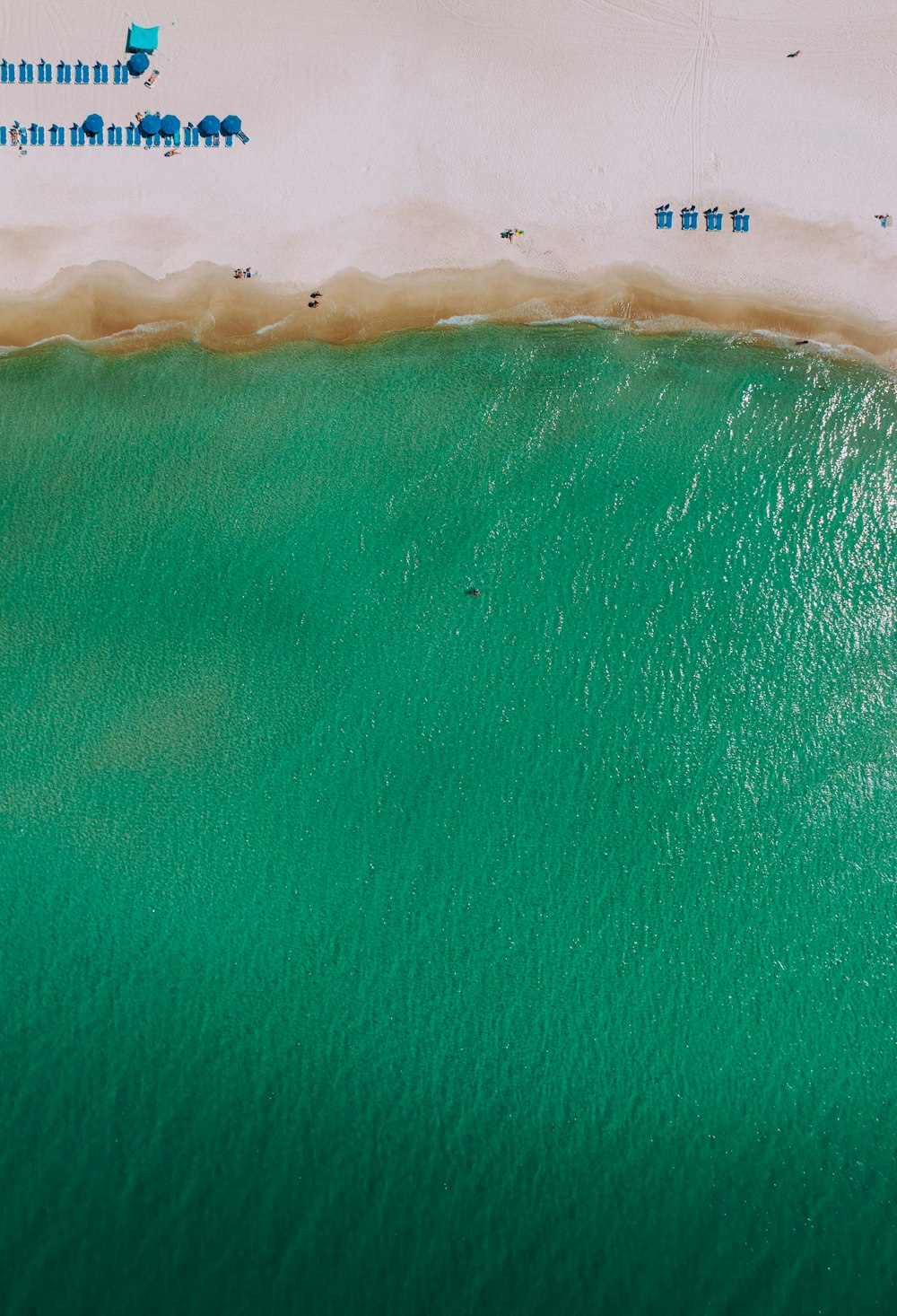 an aerial view of a beach with people on it