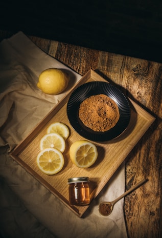 A minimalist shot of the natural sweeteners used in âu trà, displayed on a wooden table.