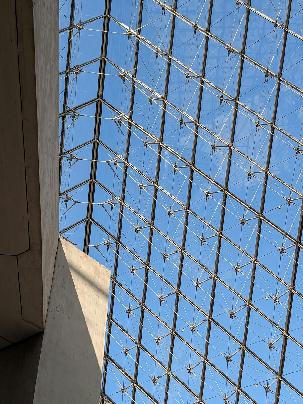 a building with a glass roof and a clock