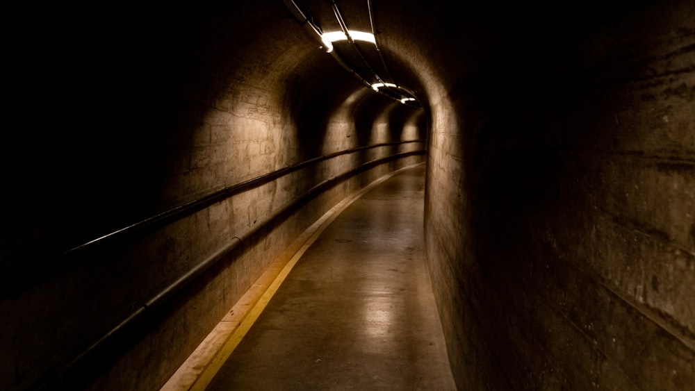 a dark tunnel with a light at the end