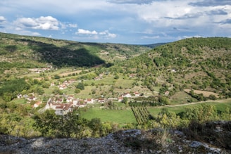 a small village nestled in a valley surrounded by mountains