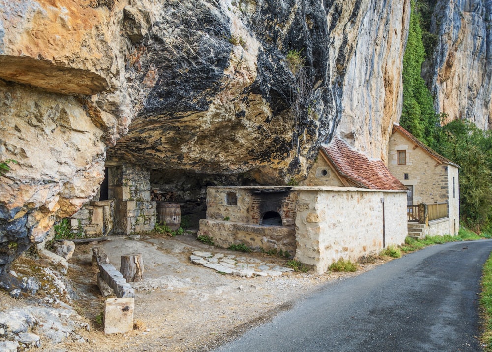 an old stone house built into the side of a cliff