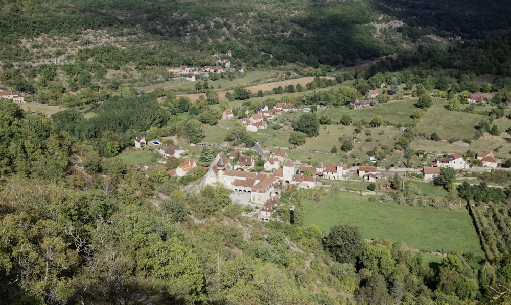 an aerial view of a village in the mountains