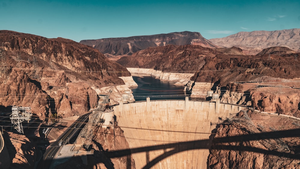 a view of a large dam in the mountains