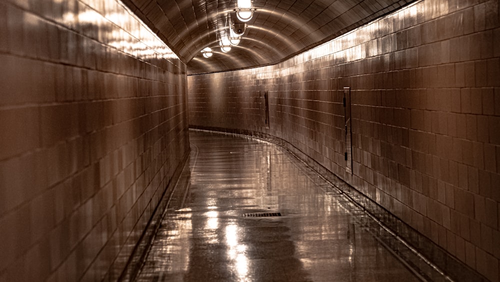 a long hallway with a light at the end of it