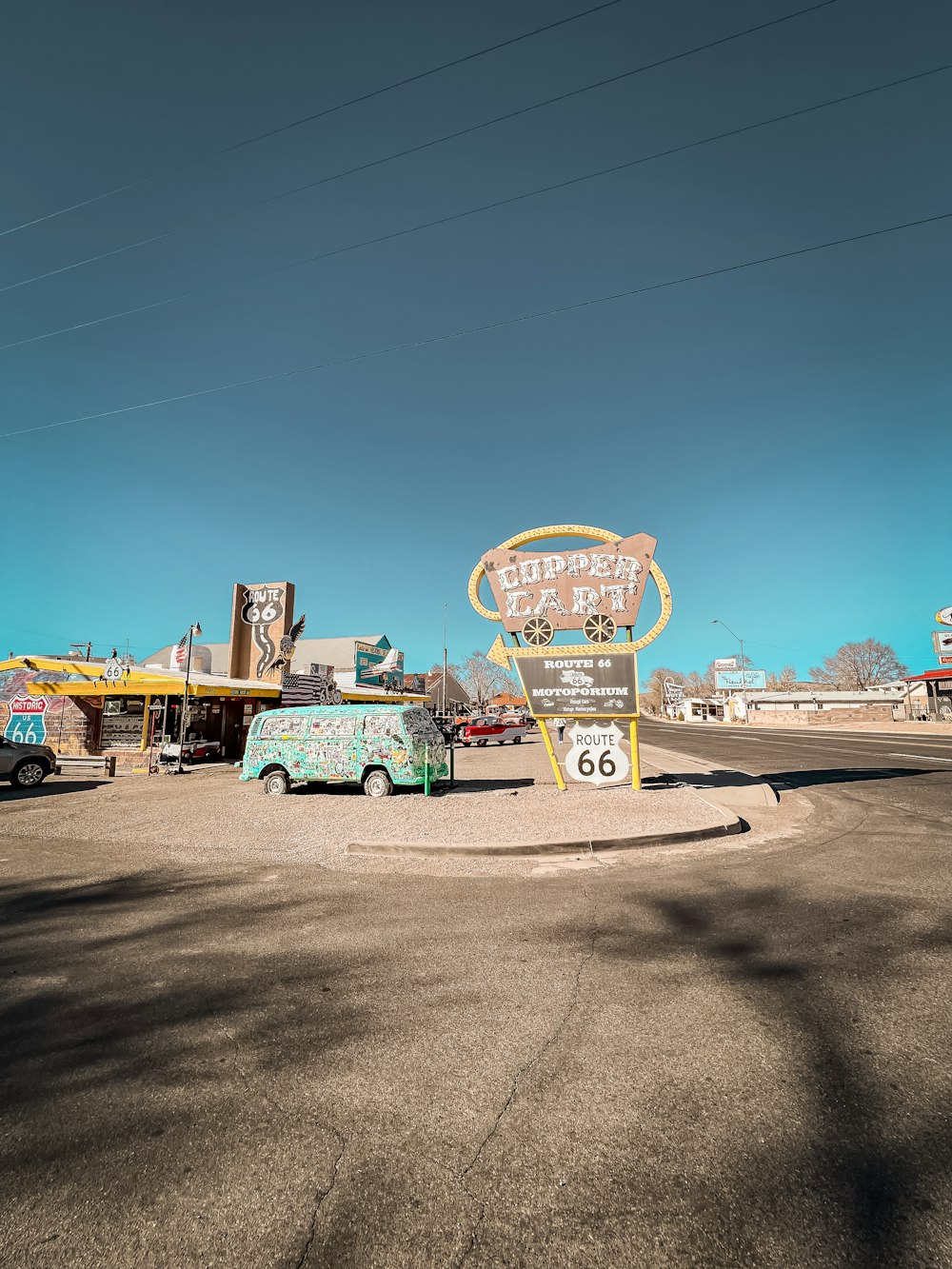 a parking lot with a sign for a gas station