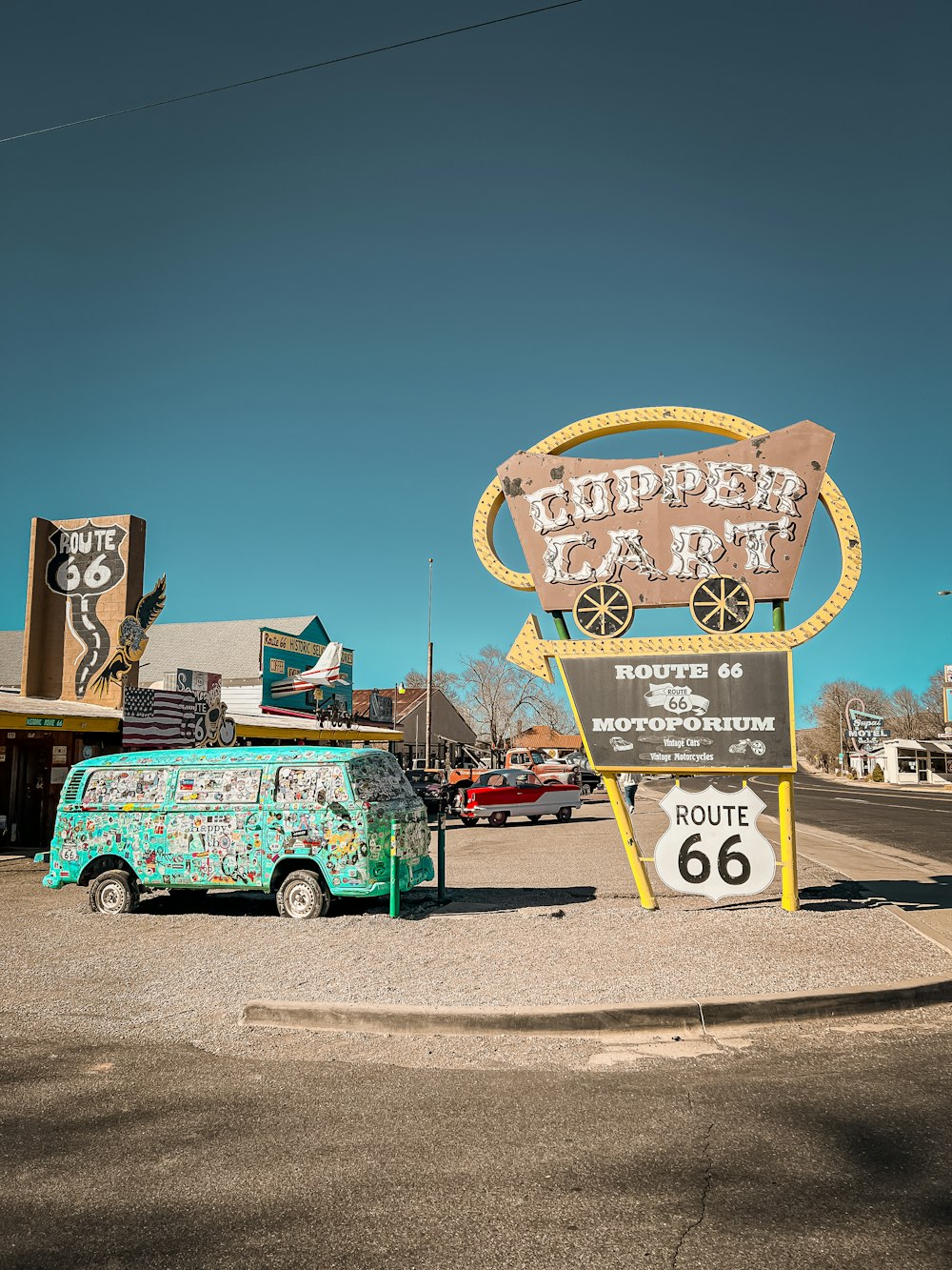 a van parked in front of a sign for a route 66