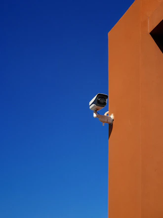 a security camera attached to the side of a building